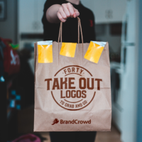 a-person-holding-out-a-take-out-bag-with-the-blog-title-printed-on-it